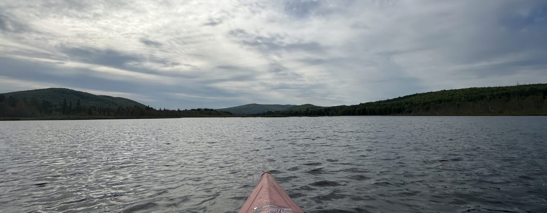 Clyde River and wetland view with mountain in the back in Charleston, the Northeast Kingdom of Vermont