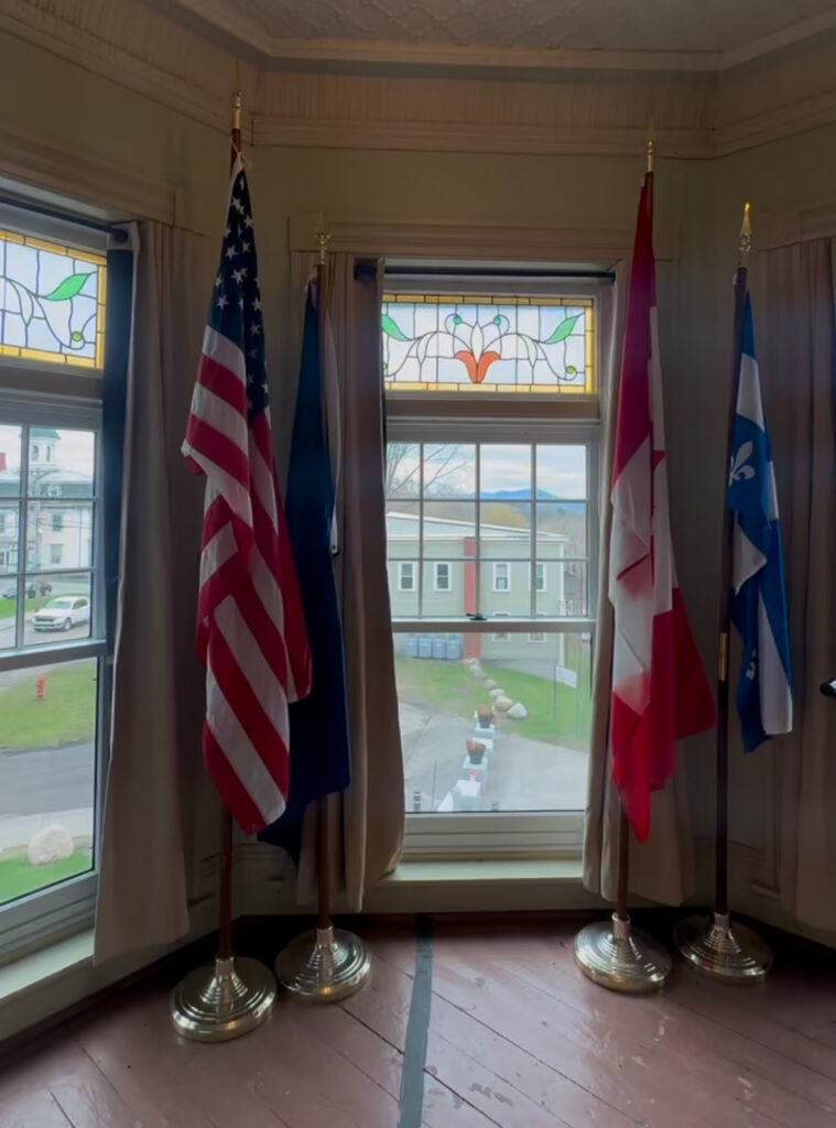 Canada/US Border line drawn across floor at the Haskell Opera House window