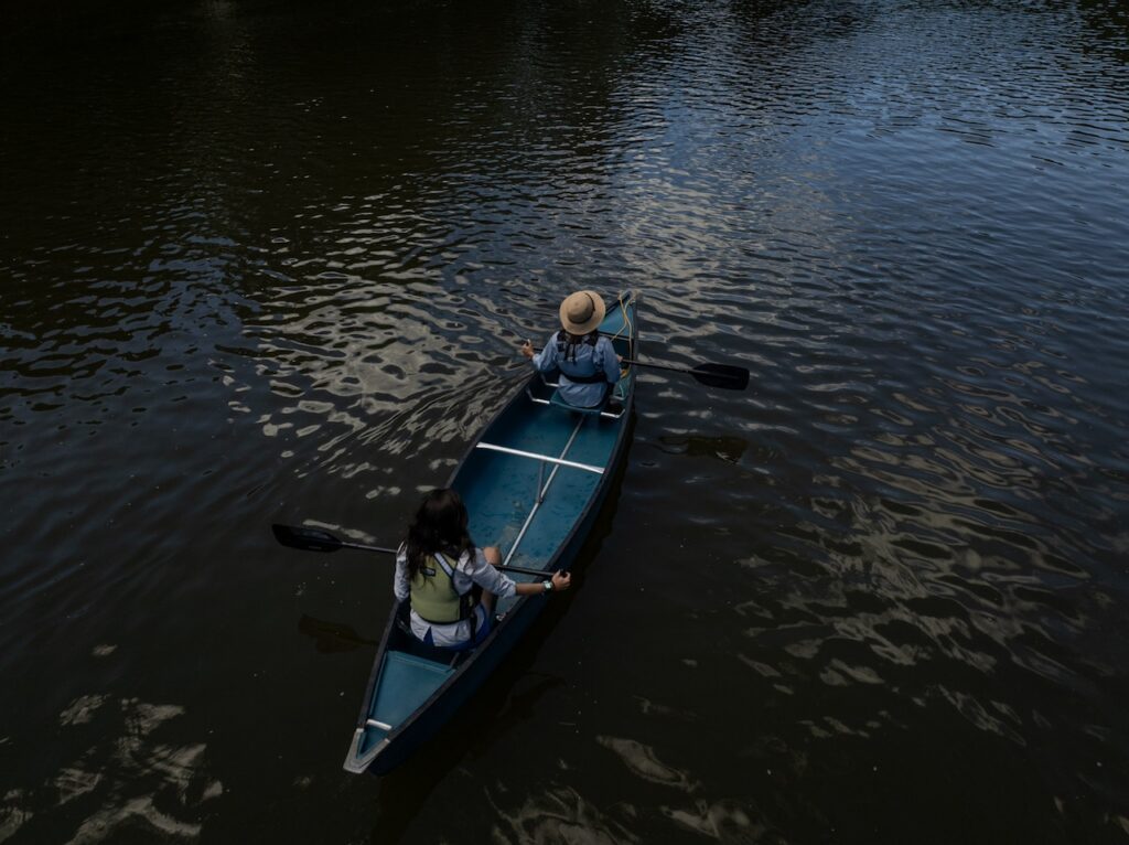 canoe drone side paddling above by evan kay