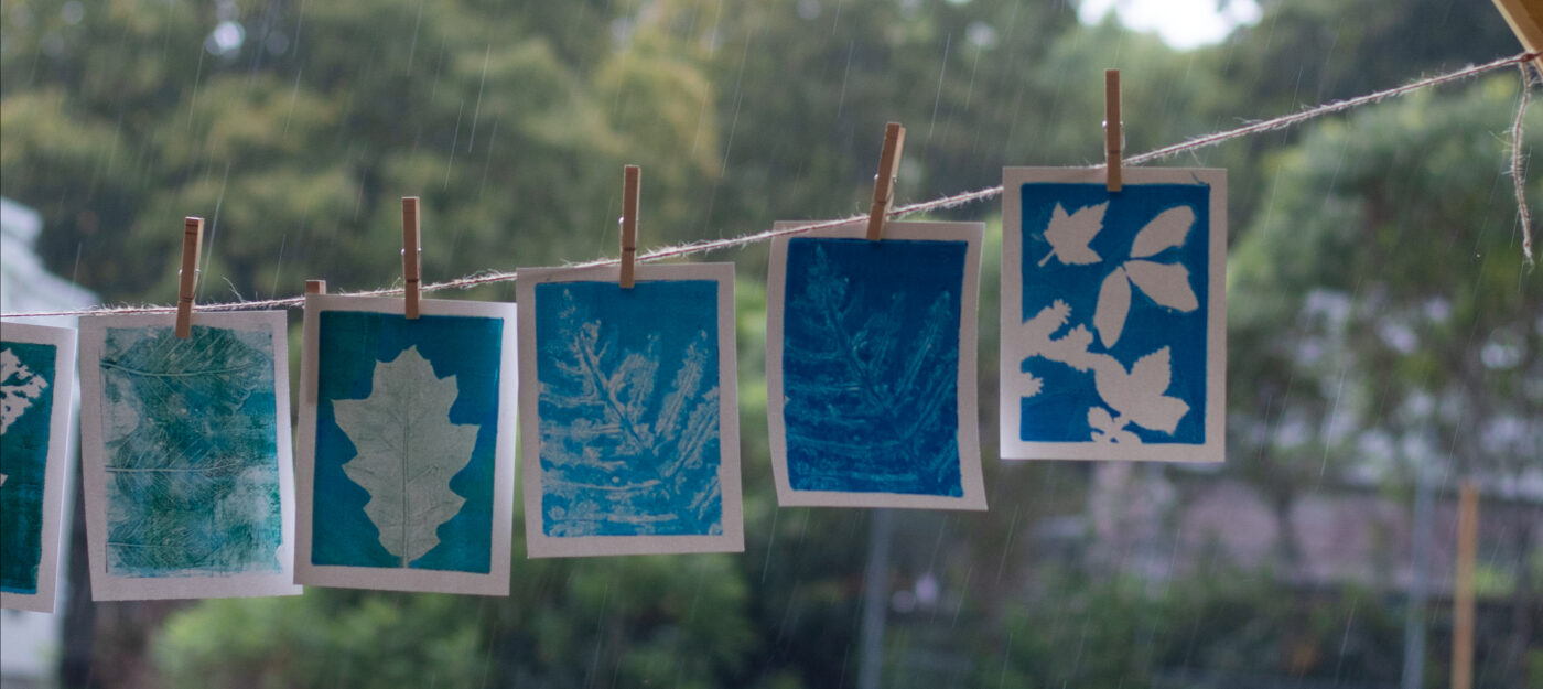 Finished monoprints drying, with the rainy afternoon continuing in the background. Photo by Gabriella Marchesani