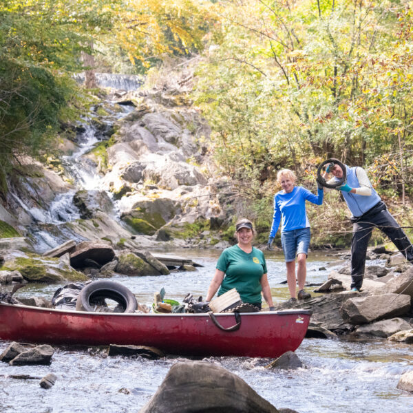 Volunteer cleanup crew with canoe.
